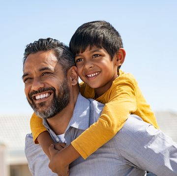 father son quotes smiling dad holding smiling son on his back